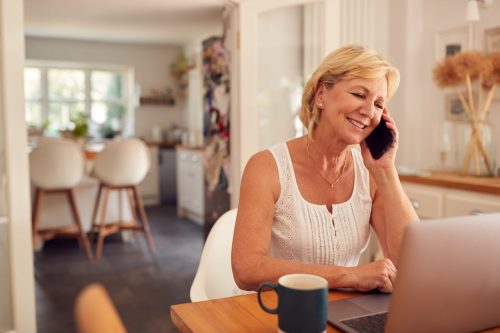 retired-woman-on-phone-at-home-in-kitchen-using-la-3NRWFMT-scaled.jpg retired-woman-on-phone-at-home-in-kitchen-using-la-3NRWFMT-scaled.jpg